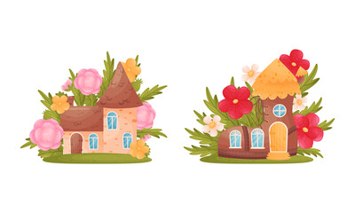 Cute fabulous cottages among summer flowers and grass set. Little stone house of gnome or elf cartoon vector illustration