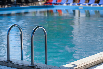 Obraz na płótnie Canvas Swimming pool with stair at sea resort