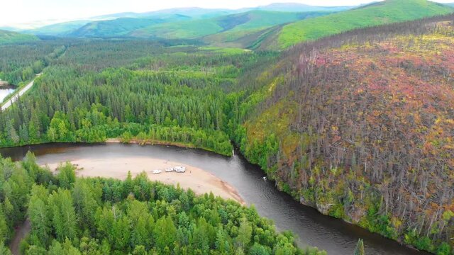 4K Drone Video of Campsite on Rock Beach of Chena River below Fire Damaged Montains near Chena Hot Springs, Alaska