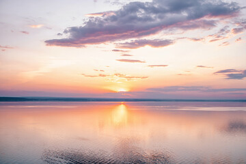 Amazing landscape at sunset. Colorful sunrise on the ocean or sea beach. Colorful nature sea sky
