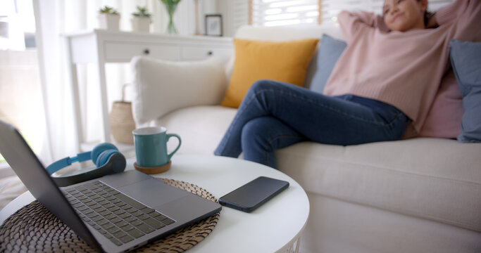 Asia Lady People Sitting Easy Hand Behind Head Work At Sofa Cozy Home Lying Down Close Cellphone With Calm Day Dream. Tired Life Time To Log Out, Leave Health Care Issue, Stop Turn Off Social Media.