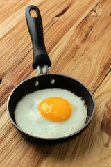 One fresh fried egg sunny side up in skillet