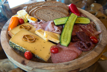 Typical traditional European snack with sausage, cheese and bread. Appetizingly prepared on a...