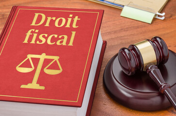 A law book with a gavel  - Financial Law in french - Droit fiscal