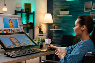 Creative photographer doing retouch work on image using professional modern equipment digital...