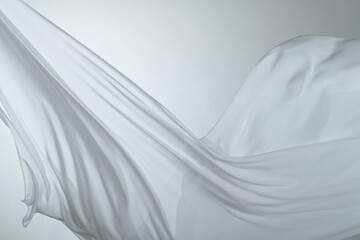 Smooth elegant colorful transparent cloth separated on white background. Texture of flying fabric.