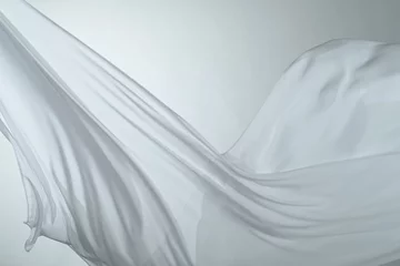 Rolgordijnen Smooth elegant colorful transparent cloth separated on white background. Texture of flying fabric. © Lukas Gojda