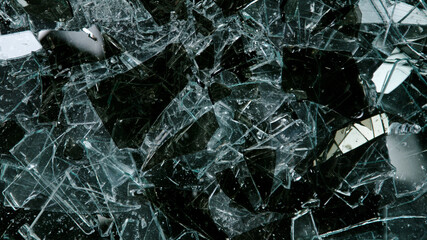 Break glass isolated on black background, top shot.