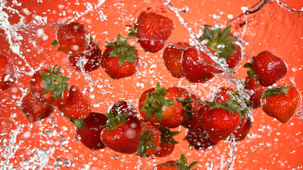 Fresh strawberries flying in the air, red gradient background.