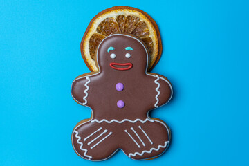 vacation at the sea. ginger cookies and a slice of orange on a blue background