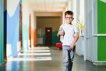 Back to school concept. School child in class. Happy kid against green blackboard. Smart child in classroom. Idea and education concept