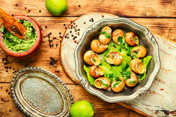 Snails baked with sauce