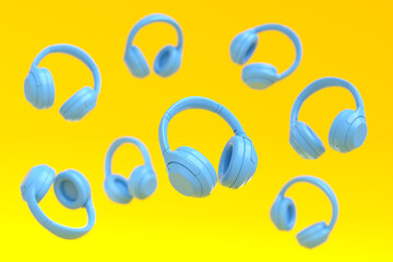 Flying blue gamer headphones or headset on yellow background