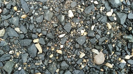 black stones pattern in the ground of the street for a textured background