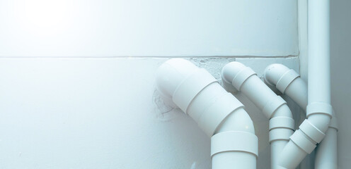 water piping PVC system install with the concrete wall