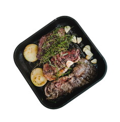 steak top view on frying pan cooking
