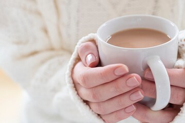 Woman holding a cup of tea