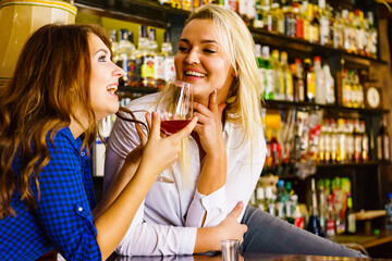 Girls in pub club gossiping and talking