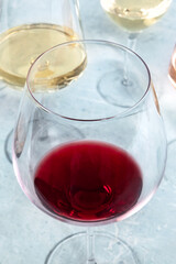 Red and white wine in different glasses at a wine tasting. Close-up shot