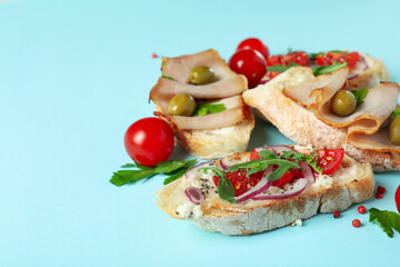 Delicious italian snacks bruschetta on blue background