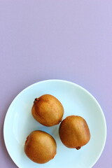 healthy kiwi on a blue plate, background
