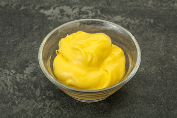 Natural cheese sauce in the bowl