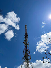 communication tower television sky clouds