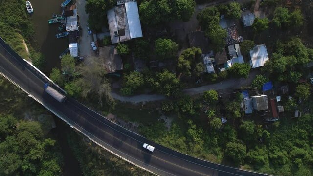 some cars and trucks passing on the highway
