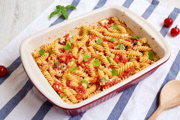 Homemade Baked Feta Tomato Pasta in a baking dish, low angle view.