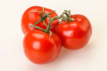 Red bright ripe tomato branch