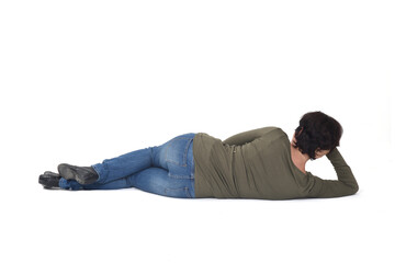 rear view of a woman lying on the floor hand on head on white background