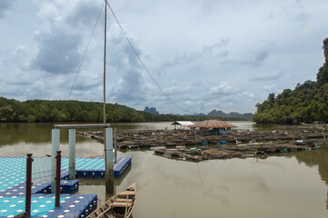 Harbor landscape with sea and fishing, mountains and sky.