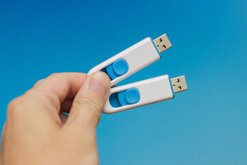hand holds two usb flash memory