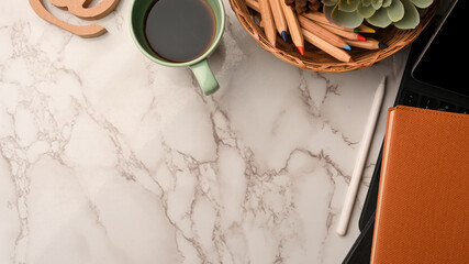 Copy space on marble background corner border with tablet, stationery