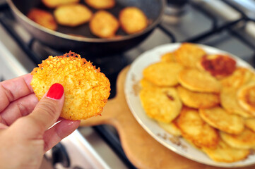 Testy Potato pancake in a hand of woman