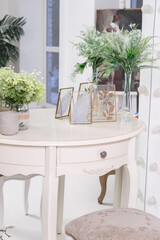 White round vanity table in front of the mirror