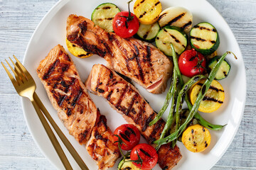 grilled salmon and vegetables on a plate