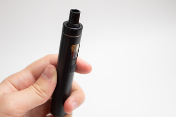 Vape device in hand. Man hand holding Electronic cigarette.