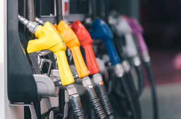 yellow red blue orange color fuel gasoline dispenser background, fuel pumps at a gas station.. - obrazy, fototapety, plakaty