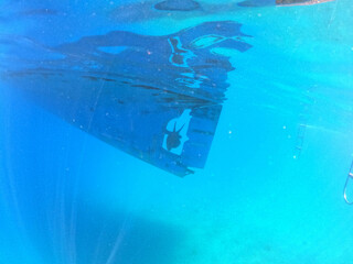 Underwater view to yacht rudder and prop, scuba diving concept. Aegean Sea. Near Marmaris, Turkey