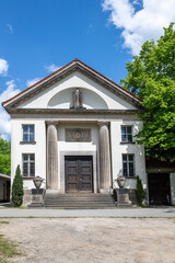 Fototapeta na wymiar historiclal building with columns in a park, blue sky