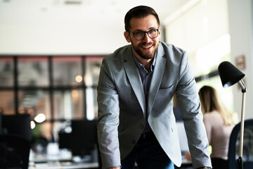 Handsome man working in the office. Businessman working on financial reports