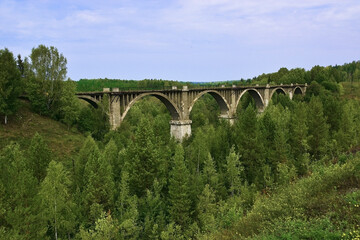 Fototapeta na wymiar An old 100-year-old viaduct