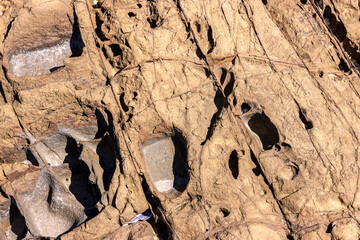 Rocks that can be seen at low tide at Melkbosstrand Cape Town, with naturally eroded visible marks caused by many years of running sea water