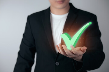 Businessman chooses options Checkmark. meaning to Standard quality control certification assurance...