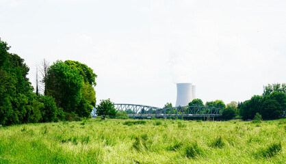 Nuclear power plant in Grohnde with cooling towers and surrounding landscape.