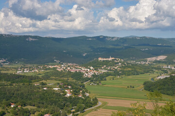 Fototapeta na wymiar Panorama shot of the city of Buzet in Istria, Croatia, with green mountains