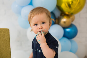 Baby boy eat blue smash cake