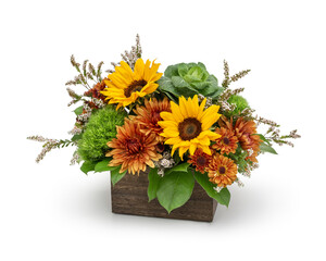 Autumn flower arrangement created in a wood box by a professional florist in a flower shop -...