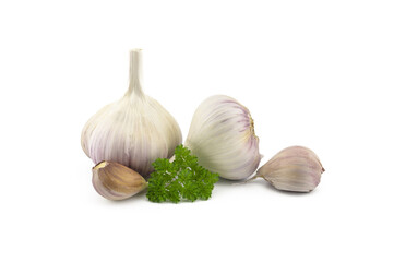 Garlic bulbs and cloves in close-up on white